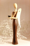 Sternkopf-Engel aus Makassar-Ebenholz, stehend, mit Kerzenhalter